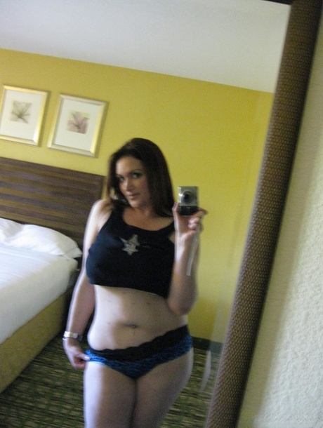 Thick female Ryan Edel takes X rated selfies in the bedroom mirror