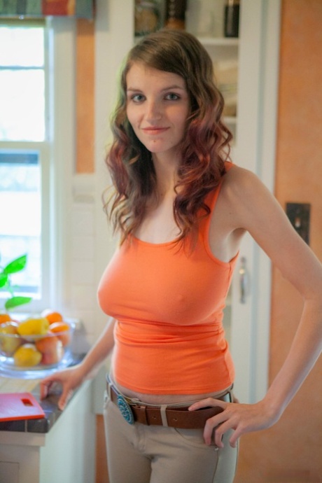 Amateur model with huge melons pulling down her shirt to let them hang