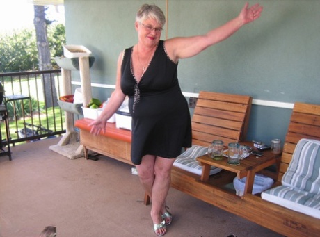 Old lady Girdle Goddess shakes her big butt while on a veranda