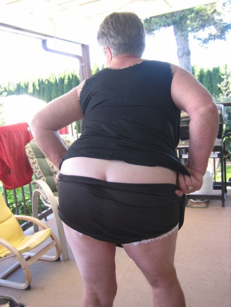 Old lady Girdle Goddess shakes her big butt while on a veranda