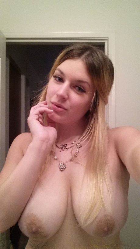 Big boobed amateur Danielle takes naked selfies around the house