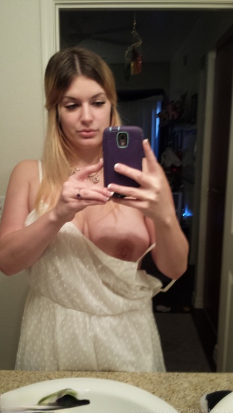 Big boobed amateur Danielle takes naked selfies around the house