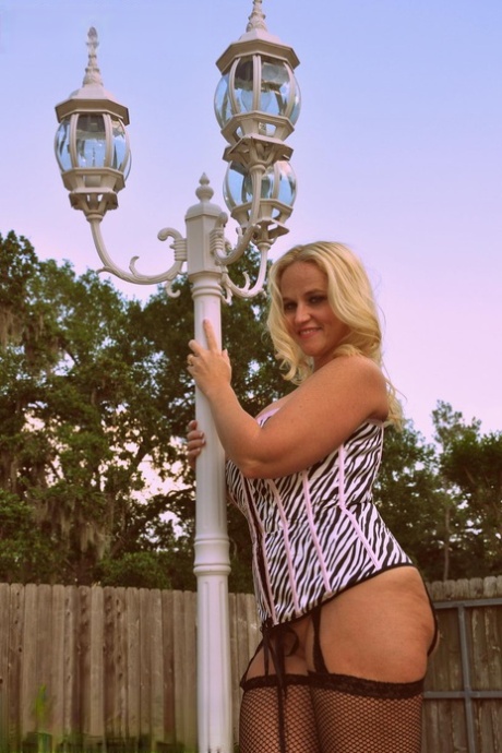 Amateur fatty Dee Siren flaunts her big butt in a corset and mesh hosiery
