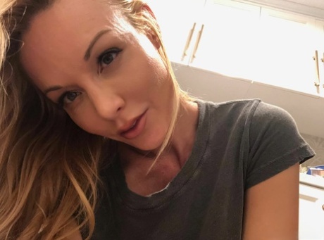 Hot blond Kayden Kross sports long nipples while taking masturbation selfies