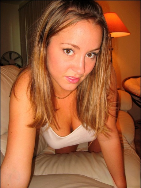 Sweet teen Mandy fondles her big boobs in a safe for work manner