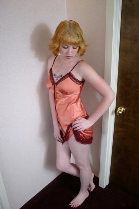 Amateur chick Barbie A sports flaming red hair while going topless