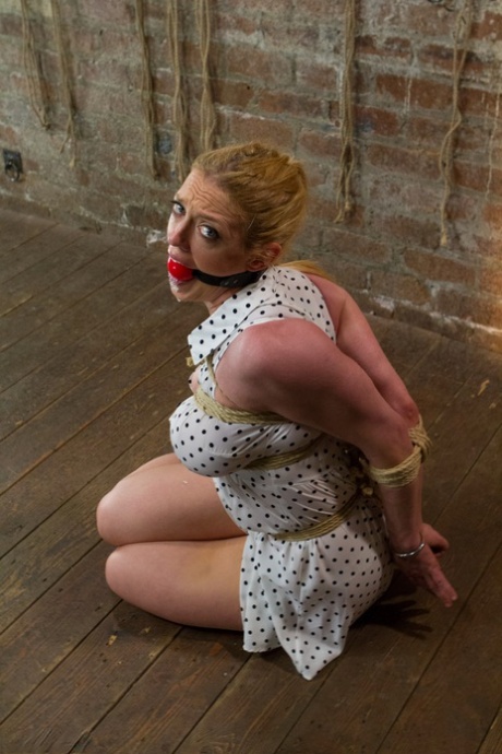 Big eyed blonde MILF Dee Williams gets her tits and ass whipped by a dom