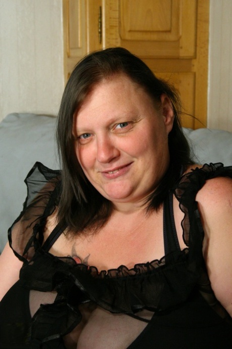 Obese older lady Katty A unleashes her massive boobs prior to dildoing herself