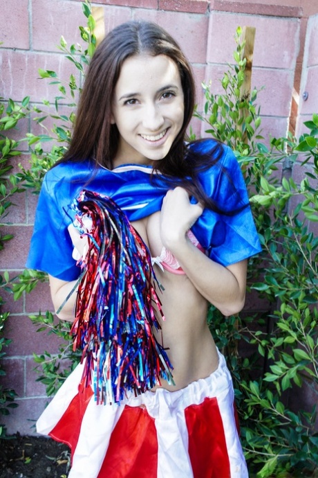 Skinny little cheerleader Belle Knox peels her uniform outdoors & rides on top