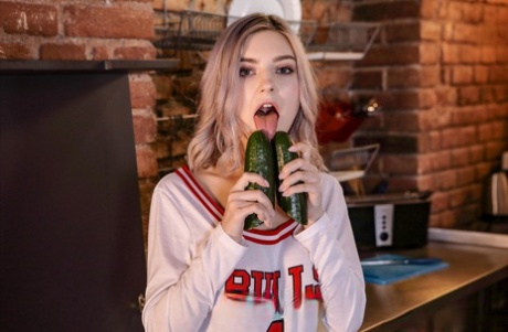Chesty blonde teen Eva Elfie toying her horny pussy with a big cucumber