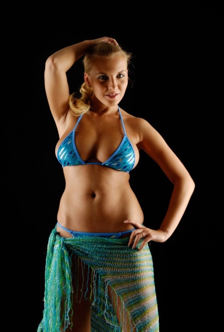Blonde teen Chikita unveils her big boobs and poses naked in hot action