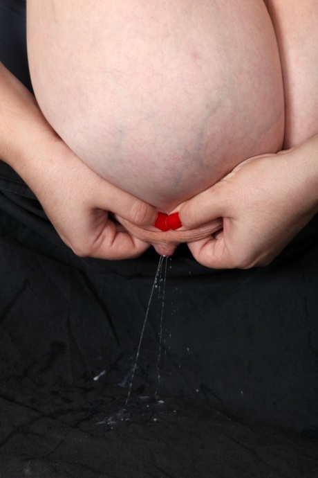 Chubby amateur Roxanne Miller shows off her giant boobs and hairy muff