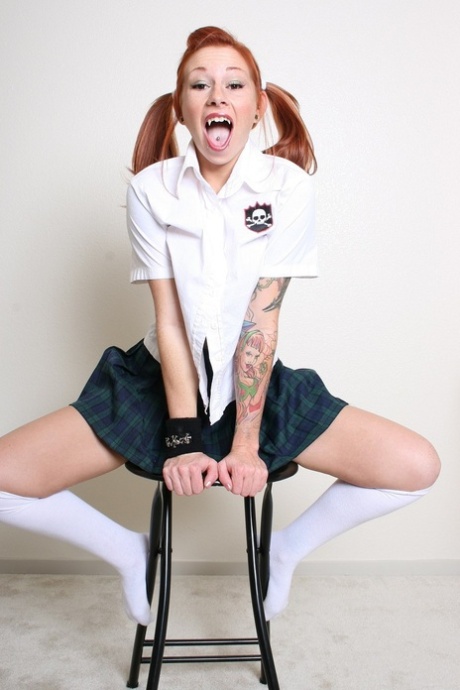 Pigtailed schoolgirl Scarlett shows her perky tits with pierced nipples & muff