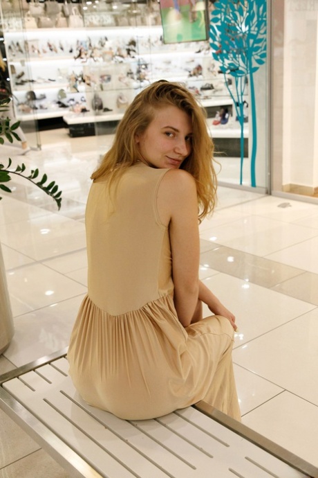 Ukrainian babe Regan Budimir flashes her big tit while posing at the mall