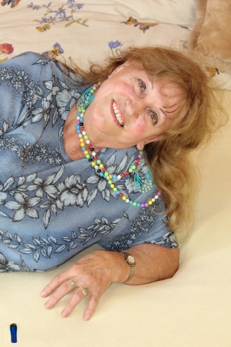 Charming granny Katerina stripping and showing her huge saggy boobs