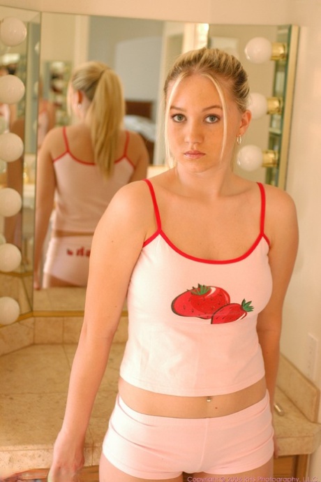 Curvy teen Alison flaunts her big breasts and squeezes her twat lips